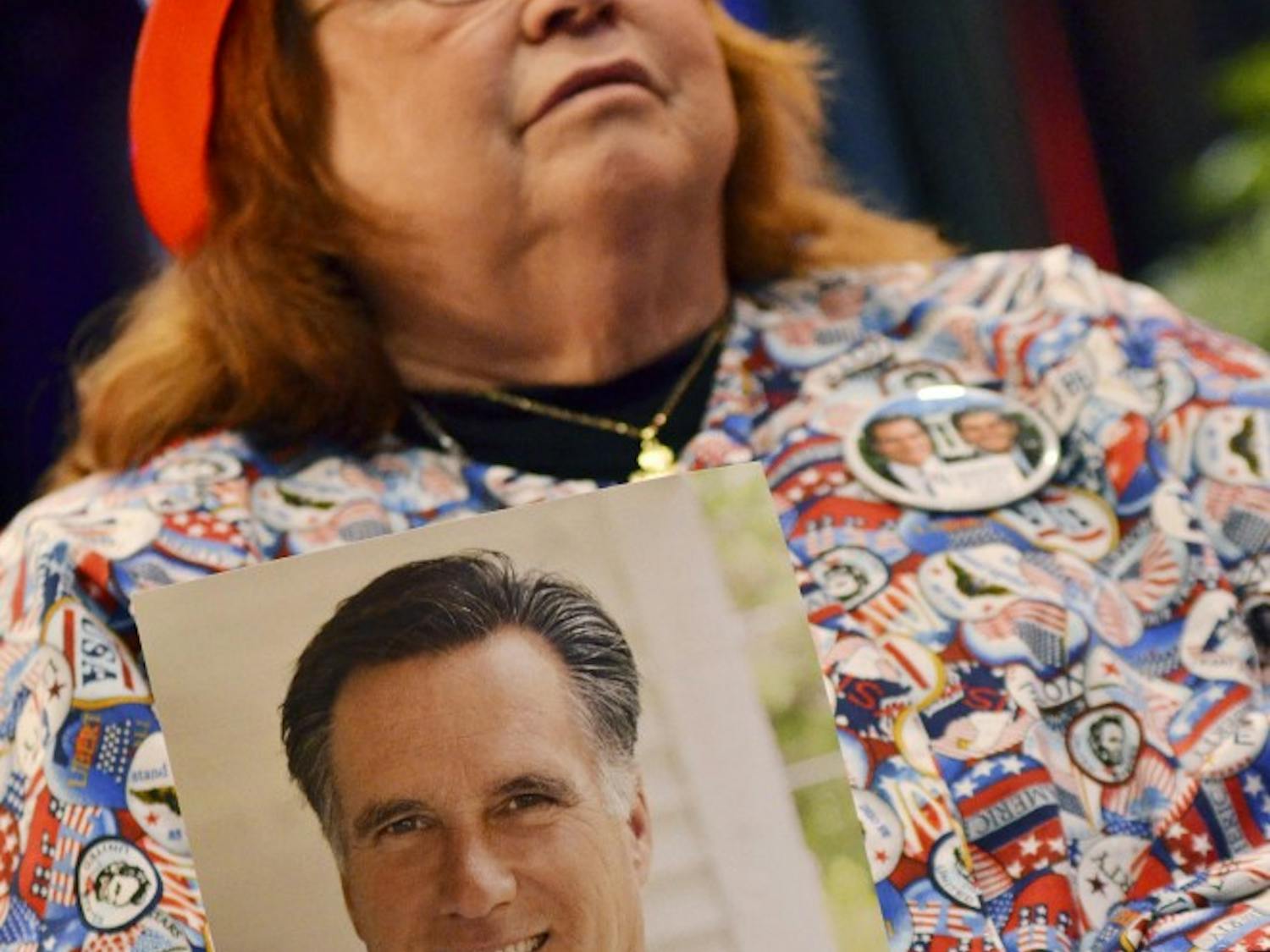 Lee Churchill seen holding a Romney photograph in her home made shirt.