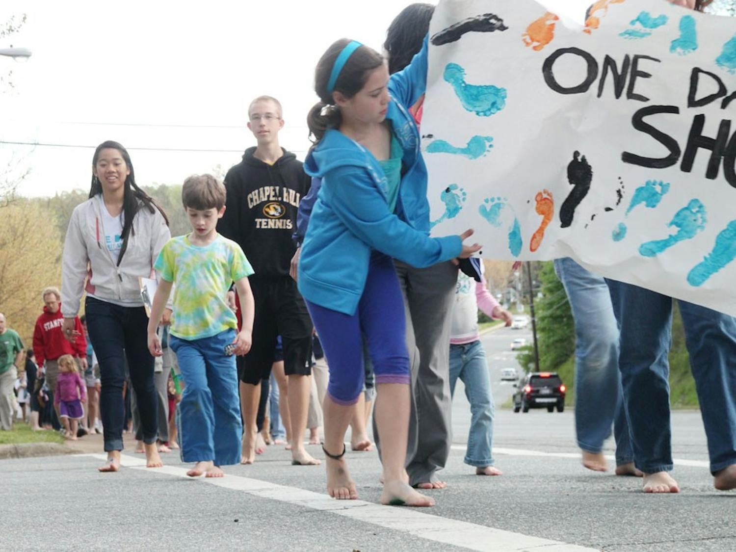 Kids and parents celebrated  the Toms shoes "One Day Without Shoes"  with the Chapel Hill YMCA by participating in a one mile barefoot walk down Martin Luther King Jr. Boulevard. 