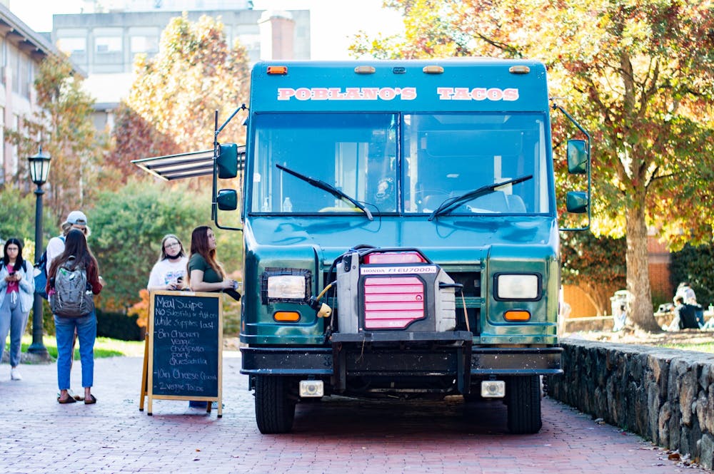 Students buy food from Porblano's Tacos, one of the food trucks that will be participating in the food truck rodeo, on Nov. 17 in front of Wilson library.