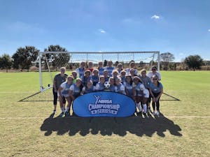 The UNC Women's Club Soccer White Team smiles after becoming the 2021 NIRSA Region 2 champions on Oct. 31, 2021. Photo courtesy of UNC Women's Club Soccer. 
