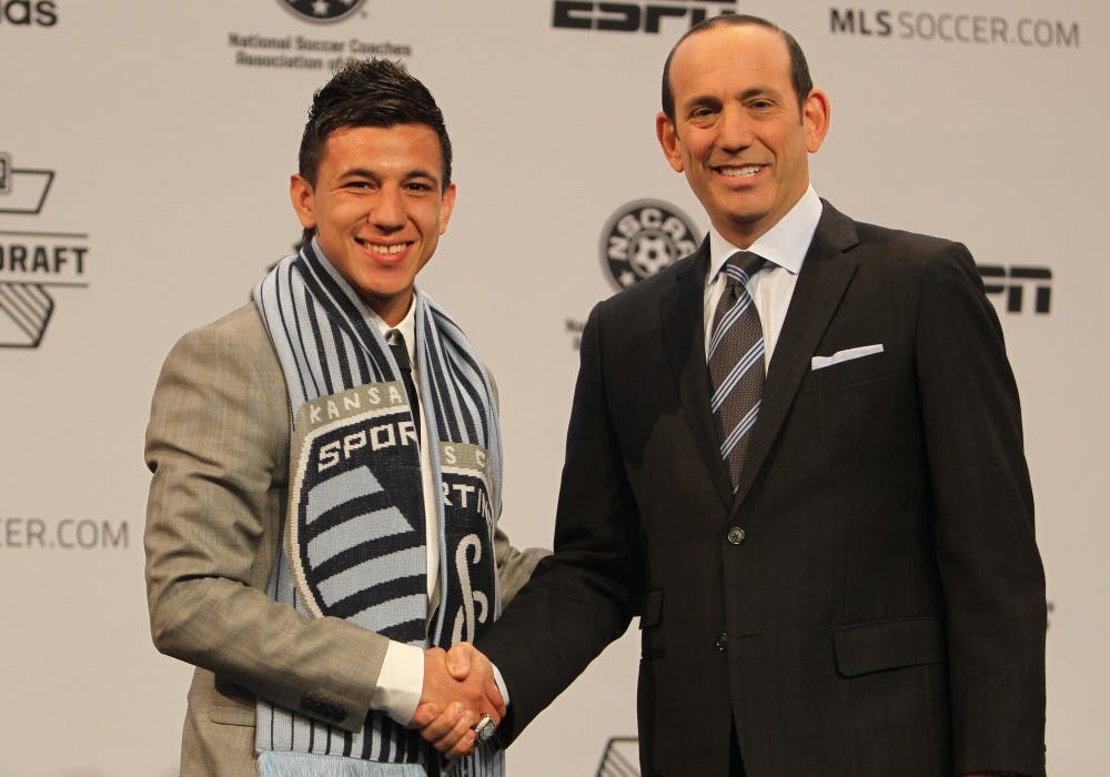 	<p>Mikey Lopez shakes hands with <span class="caps">MLS</span> Commissioner Don Garber after being selected by Sporting KC.</p>