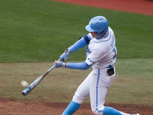 UNC sophomore outfielder Caleb Roberts hits his first of two home runs during Carolina's 8-1 season-opening victory over James Madison at Boshamer Stadium, Feb. 19, 2021.