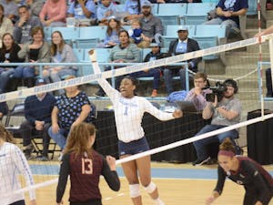 First-year outside hitter Destiny Cox (1) celebrates after a successful kill during the Wednesday, Nov. 21, 2018 game against FSU. UNC lost the game 3-0. 