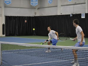 Sophomore William Blumberg and senior Robert Kelly compete in doubles on March 2 at the Cone-Kenfield Tennis Center.