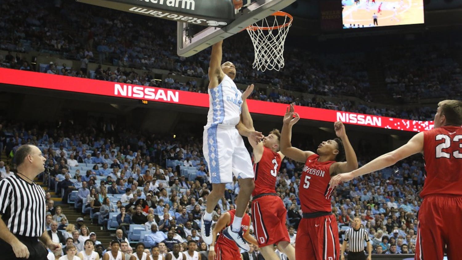 Forward Brice Johnson (11) lays the ball in during UNC's 98-65 route of Davidson.