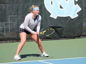 Alle Sanford prepares to return a serve during her doubles victory over Maya Tahan and Florencia Urrutia of the University of Miami on March 6, 2021.