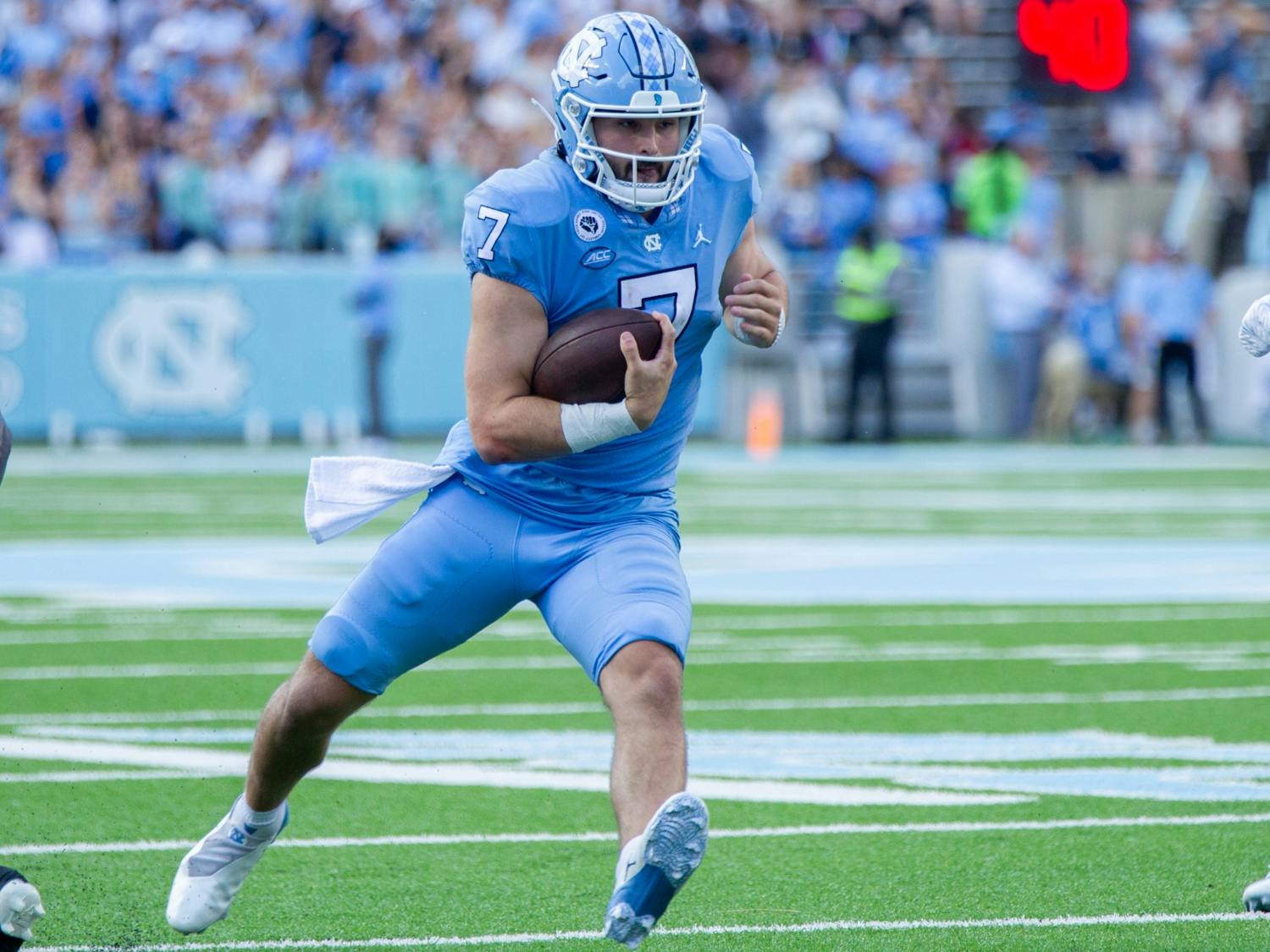Junior quarterback Sam Howell (7) carries the ball at the game against Miami on Oct. 16 at Kenan Stadium. UNC won 45-42.
