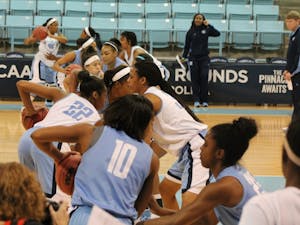 The North Carolina women's basketball team goes through a ball-handling drill during practice Saturday afternoon.