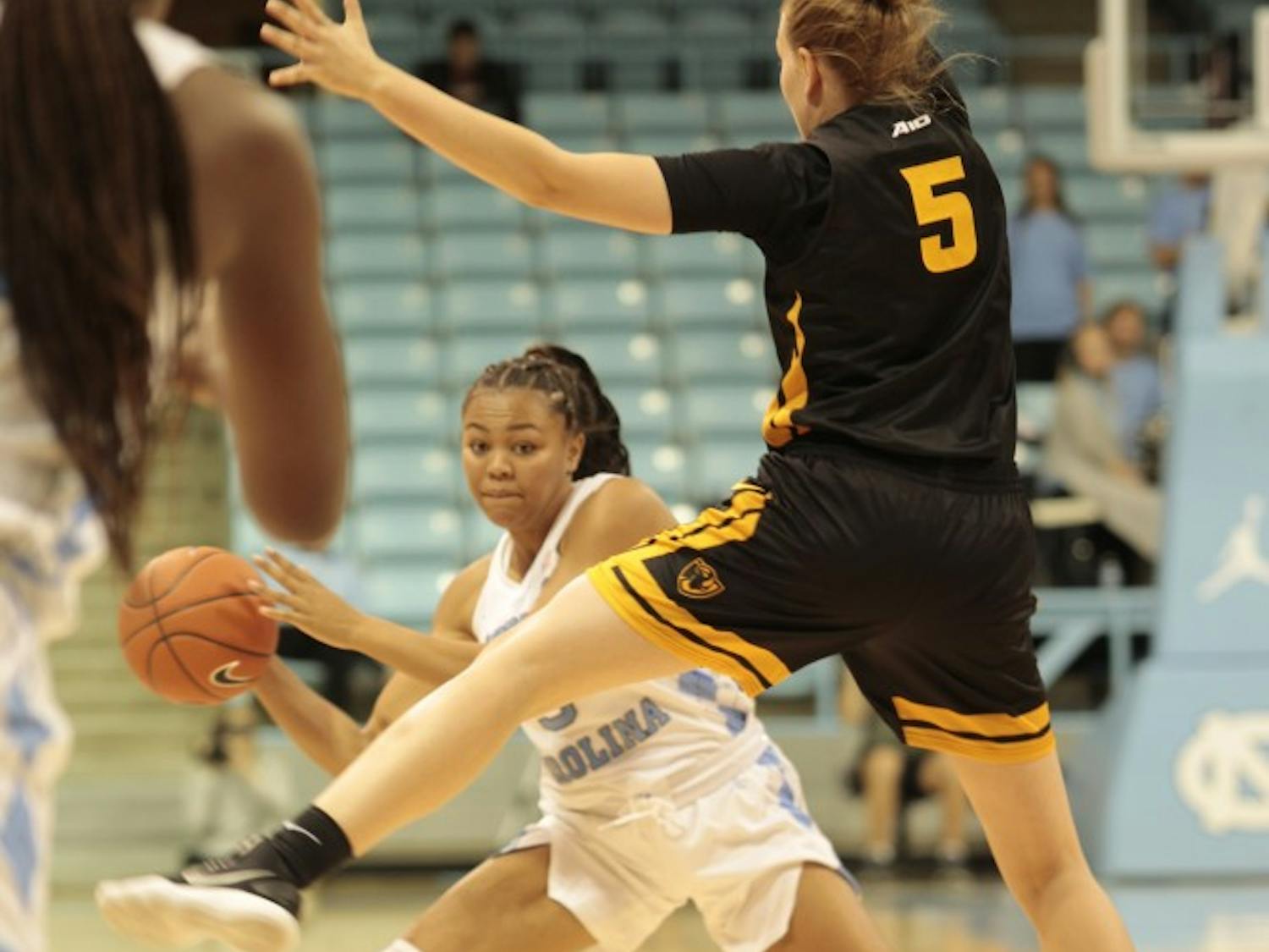 Junior guard Stephanie Watts (5) passes the ball during Wednesday's game against Virginia Commonwealth University at Carmichael Arena. UNC won 59-47.