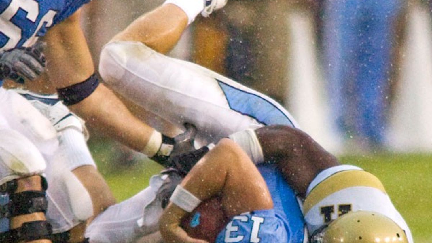 Quarterback TJ Yates gets sacked in the fourth quarter of Carolina's 7 to 24 loss to Georgia Tech. DTH/Andrew Dye