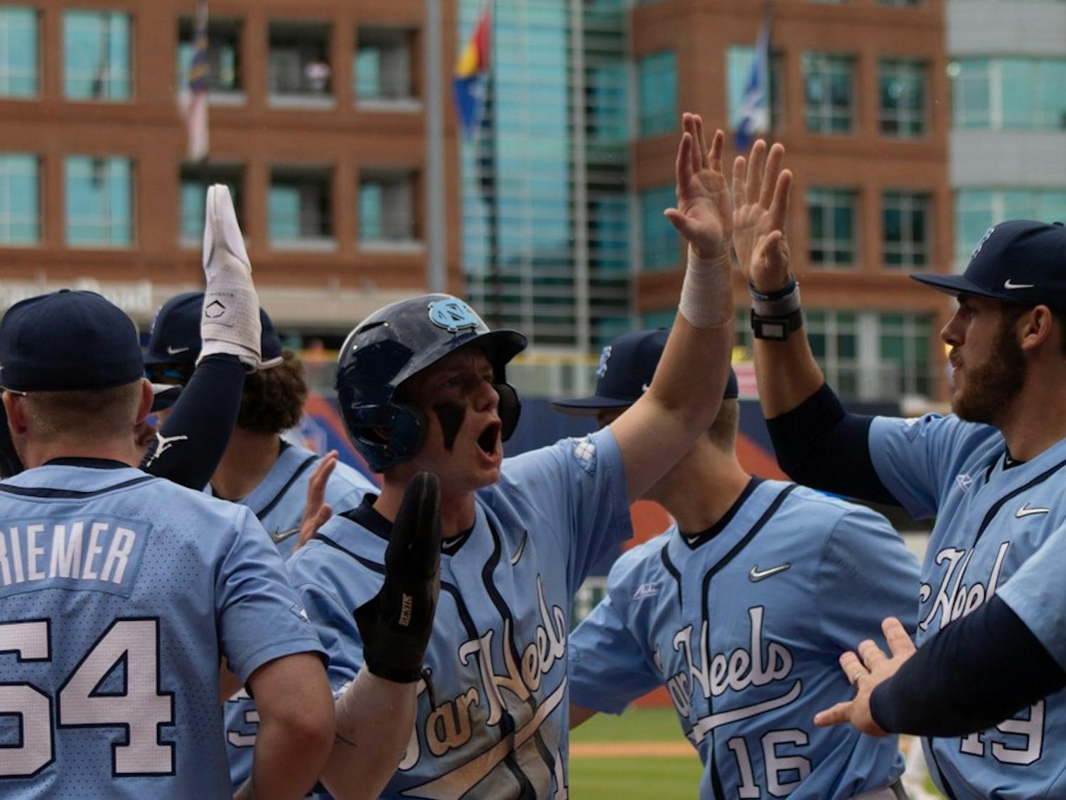 The Diamond Heels celebrate a 10-2 win against the Virginia Cavaliers on Thursday, May 25, 2023 at the Durham Bulls Athletic Park.