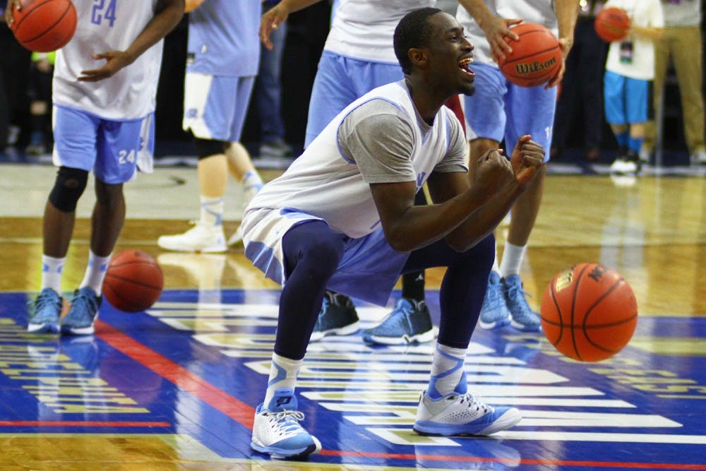 Theo Pinson celebrates while the team makes half-court shots during practice before their Sweet 16 match-up against Indiana.&nbsp;