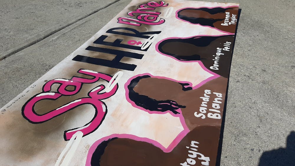 <p>Nina Scott, a graduate of Carrboro High School and an incoming UNC first-year, painted a mural on Sunday, July 12, 2020 honoring some of the Black women who have been killed.</p>