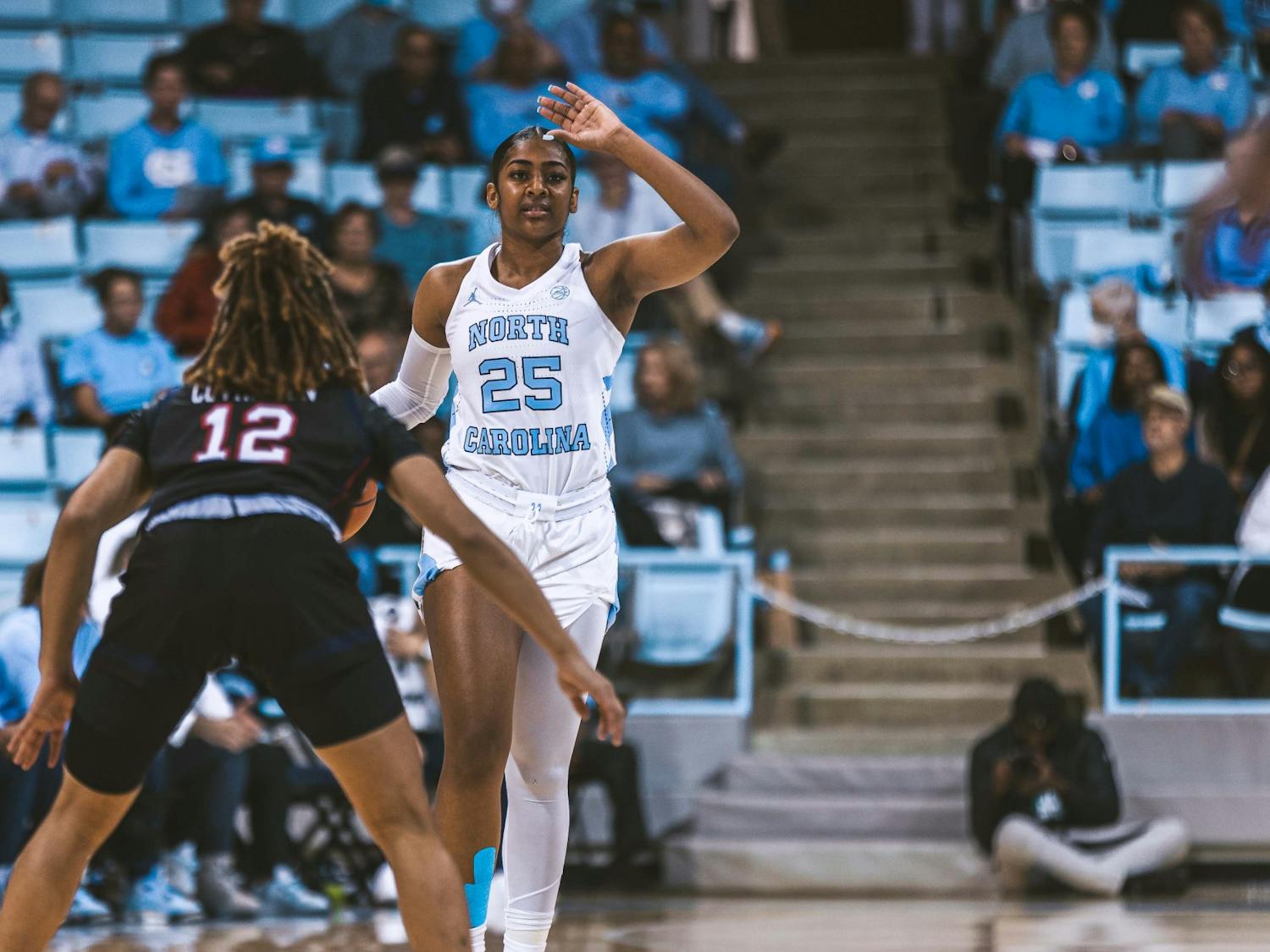 UNC junior guard Deja Kelly (25) motions to a teammate during the women's basketball game against Jackson State in Carmichael Arena on Wednesday, Nov. 9, 2022. UNC beat Jackson State 91-51.