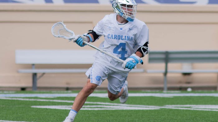 UNC senior attackman Chris Gray (4) prepares to catch the ball during the game against Notre Dame on April 25, 2021 at Kenan Stadium. The Tar Heels' defeated the Fighting Irish 12-10.