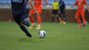 A UNC player prepares to kick a ball during a game against Clemson at Dorrance Field on Friday, Oct. 9, 2020. UNC won the game 1-0. 