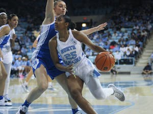 UNC sophomore guard Deja Kelly (25) drives the ball into the paint during a home women’s basketball game against Duke on Sunday, Feb. 27, 2022, at Carmichael Arena.