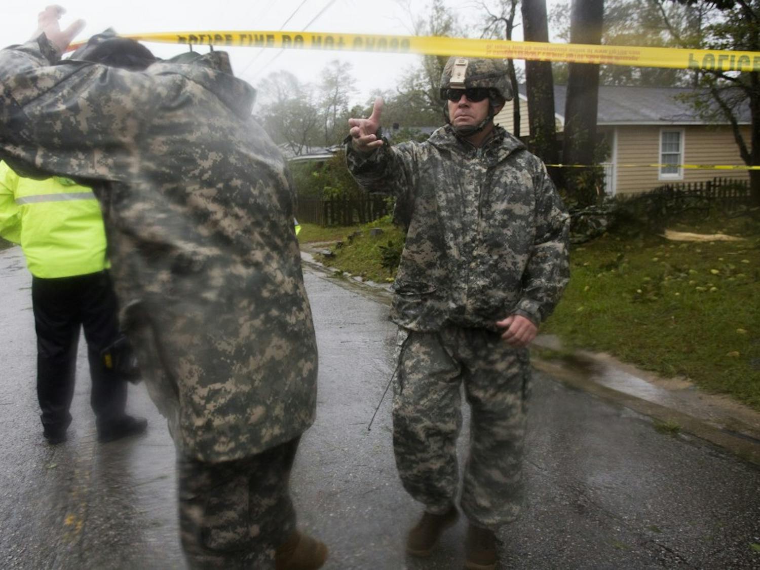 Members of the National Guard exit the scene where a fallen tree, due to hurricane Florence, critically injured a father and took the life of a mother and infant on Friday, September 14th in Wilmington, NC. The National Guard was one of many first-responders that rendered assistance in the recuse and subsequent recovery efforts at a residence on Mercer Ave, in Wilmington.