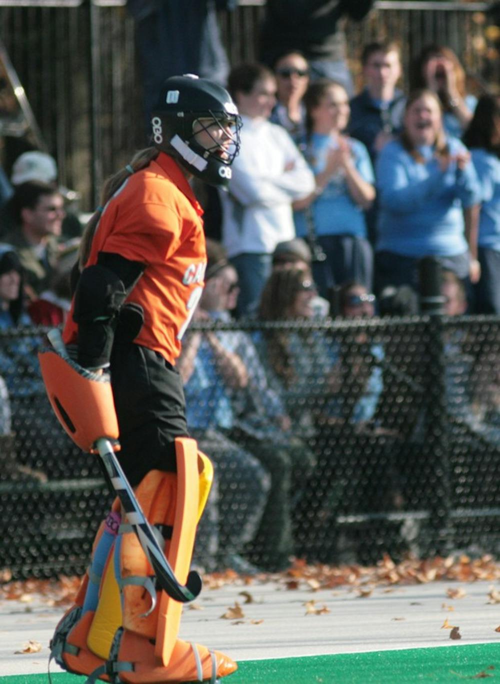 Goalie Jackie Kintzer directs her team from the goal. Kintzer logged nine saves and fought off a strong Terrapin offense.