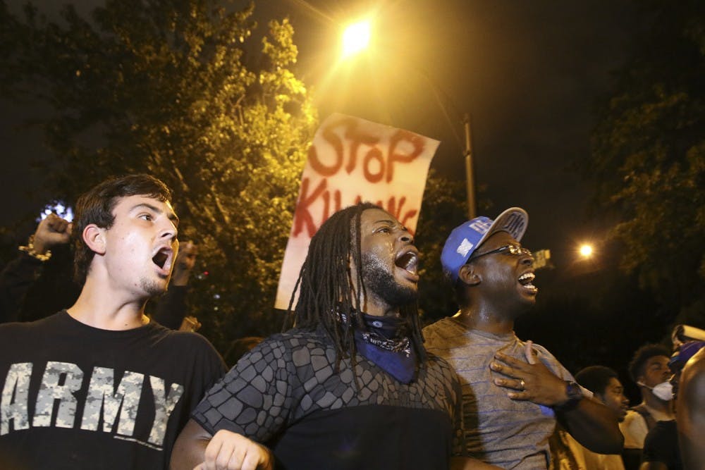 <p>Protestors march through the streets of Charlotte on September&nbsp;22nd in response to the police shooting of Keith Scott.</p>