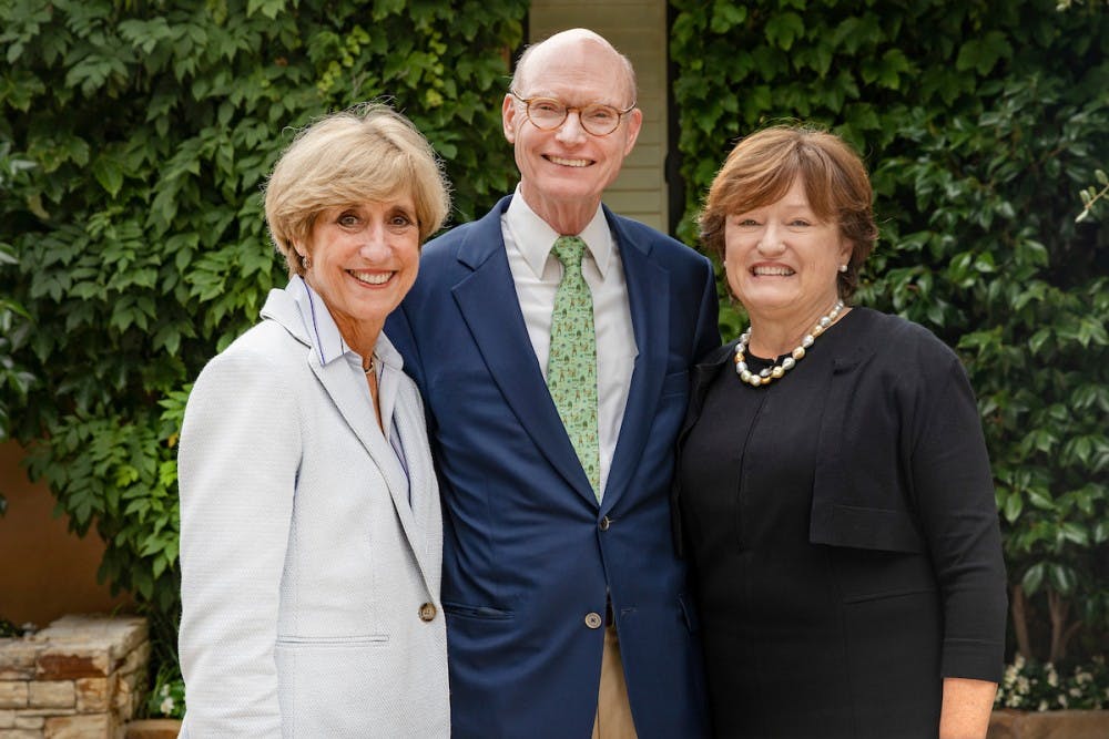 <p>Walter Hussman and his wife, Ben, meeting with Dean Susan King at their home on Aug. 6, 2019. The School of Media and Journalism will be known as the Hussman School of Journalism and Media following a $25 million gift from Walter and Ben Hussman. Photo courtesy Johnny Andrews/UNC-Chapel Hill.&nbsp;</p>