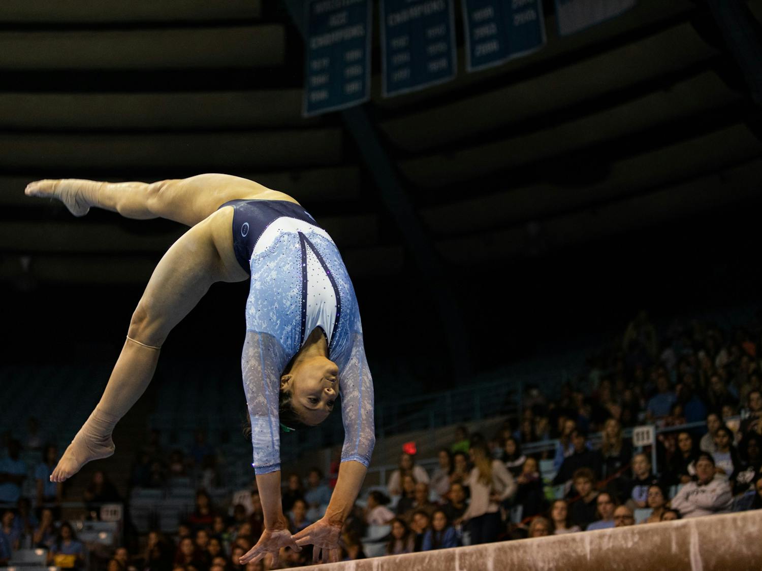 UNC sophomore Julia Knower flips on the beam during UNC's competition against George Washington on Saturday, Jan. 28, 2023 at Carmichael Arena. UNC won 196.325-195.350.