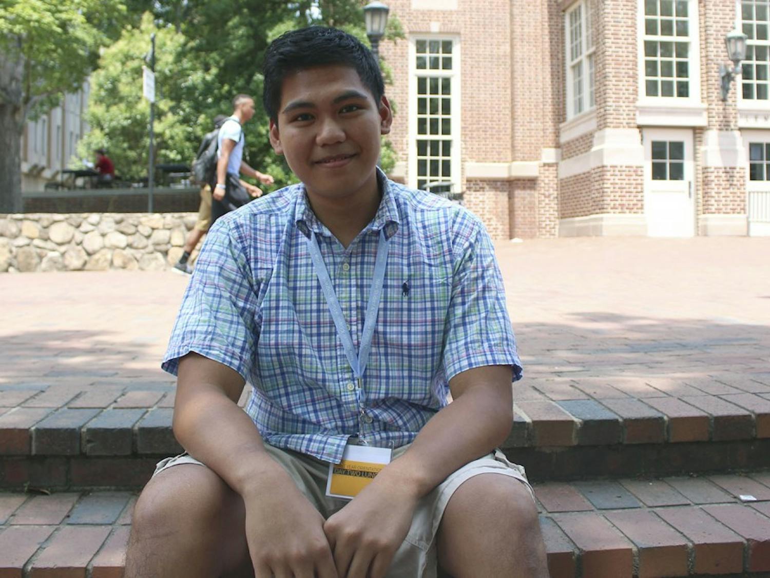Lawrence Bacudio, a NCSSM graduate and future freshman at UNC, attends orientation despite financial issues as he awaits his green card.