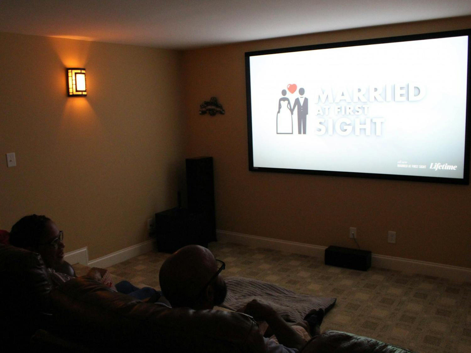 DTH Photo Illustration. People watch "Married at First Sight", a reality TV show on Lifetime TV. Over quarantine, many people have turned to various dating shows to stay entertained.