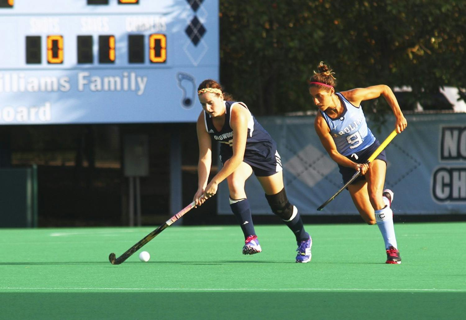 The UNC field hockey team beats Longwood on Friday afternoon, Oct. 9, with a score of 8-1. Emily Wold (9) defends an opponent.