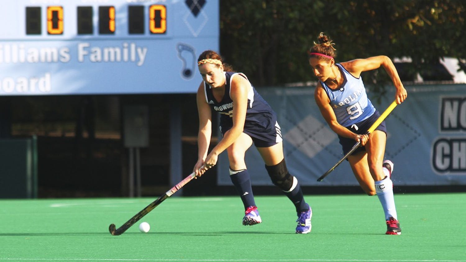 The UNC field hockey team beats Longwood on Friday afternoon, Oct. 9, with a score of 8-1. Emily Wold (9) defends an opponent.