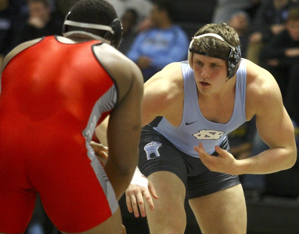 Daniel, Cory grapples with opponent 