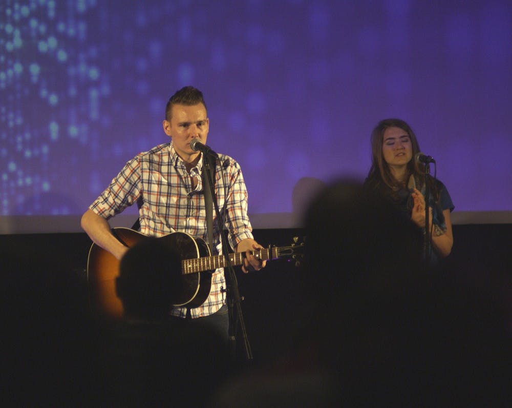 <p>Jason Tuggle, lead singer of Delta Son, performs at Love Chapel Hill, a church congregation in Chapel Hill.&nbsp;Photo Courtesy of Matt Leroy.</p>