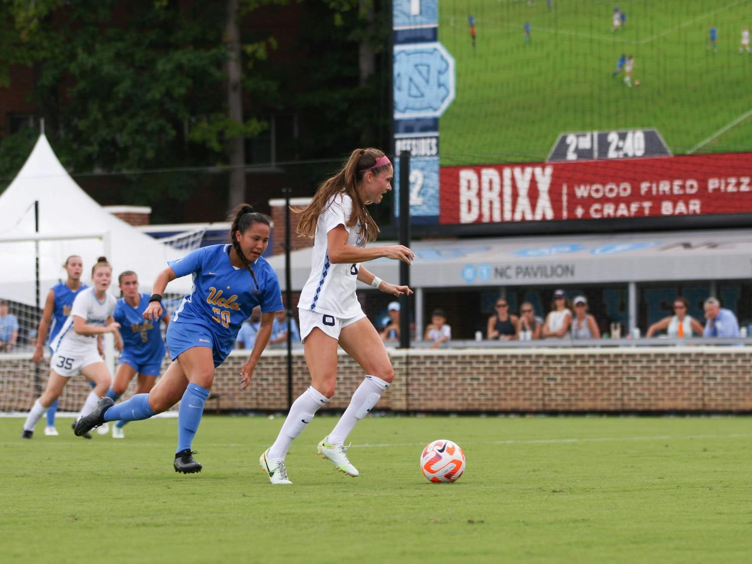 Senior forward Emily Moxley (8) defends the ball in the game versus UCLA at Dorrance Field on Sept. 4, 2022. UNC falls to UCLA with a score of 2-1.