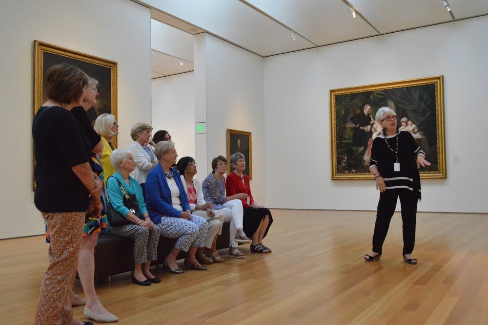 Docent Rhonda Wilkersen leads women from the Oxford Study Group around the "History and Mystery" exhibit in the NC Museum of Art, which showcases the best of the museum's Old Master British paintings and sculptures.  The exhibit is a result of the Scott Project, an effort to unveil the origin of these works by students and faculty from UNC and Duke in partner with the museum.