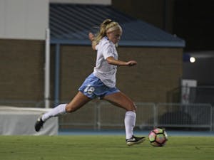 Megan Buckingham (18) dribbles down the field in Thursday night's match against Miami, leading the&nbsp;Tar Heels to a 3-1 victory.