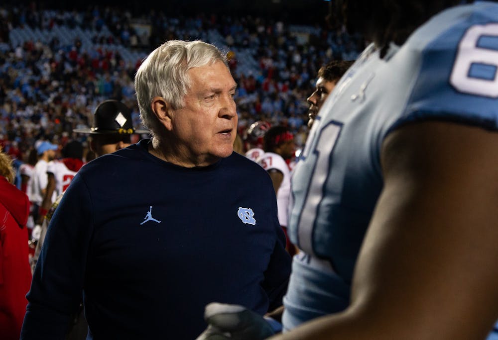 UNC head coach, Mack Brown, exits Kenan Stadium on Nov. 25, 2022, as the Tar Heels lost against the NC State Wolfpack 30-27.