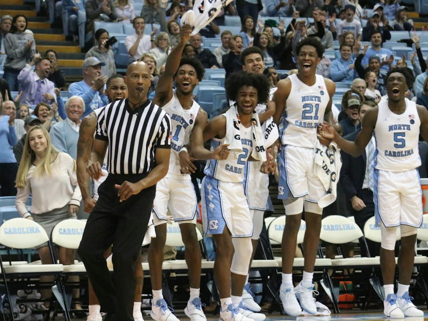 The UNC bench goes wild after forward Brandon Huffman (42) dunks on Tennessee Tech on Friday, Nov. 18, 2018 in the Smith Center.