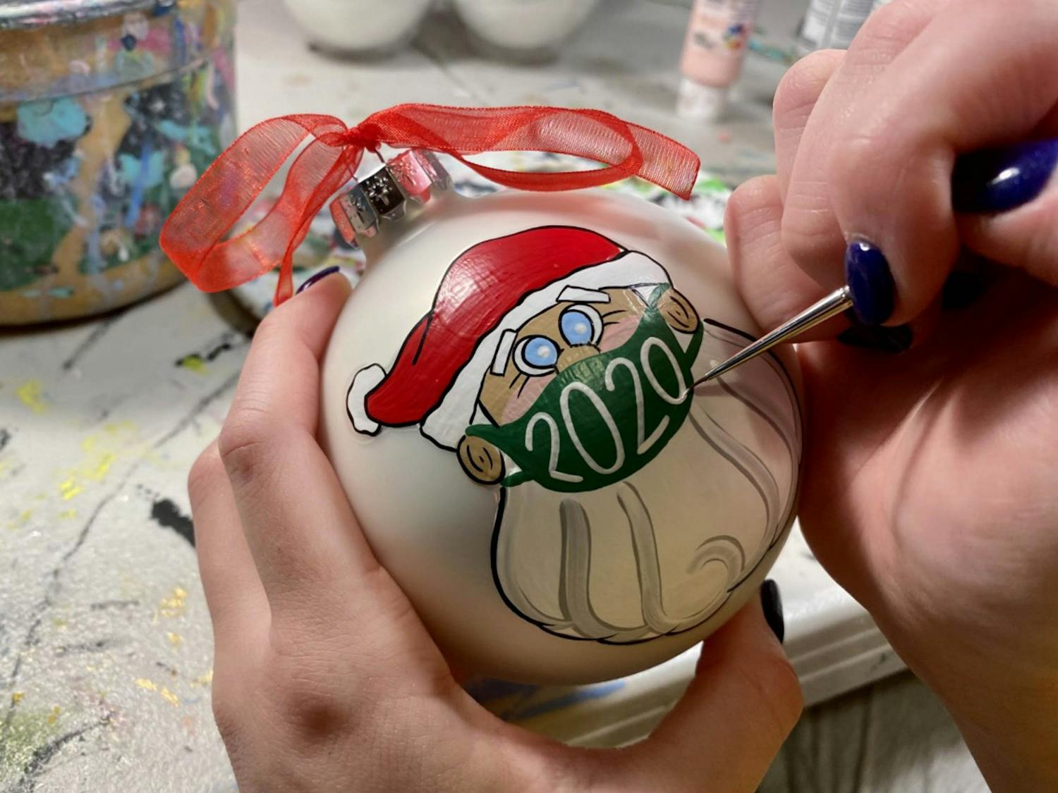 Junior Anna Eskew paints a Christmas ornament on Nov. 30, 2020. Photo courtesy of Anna Eskew.