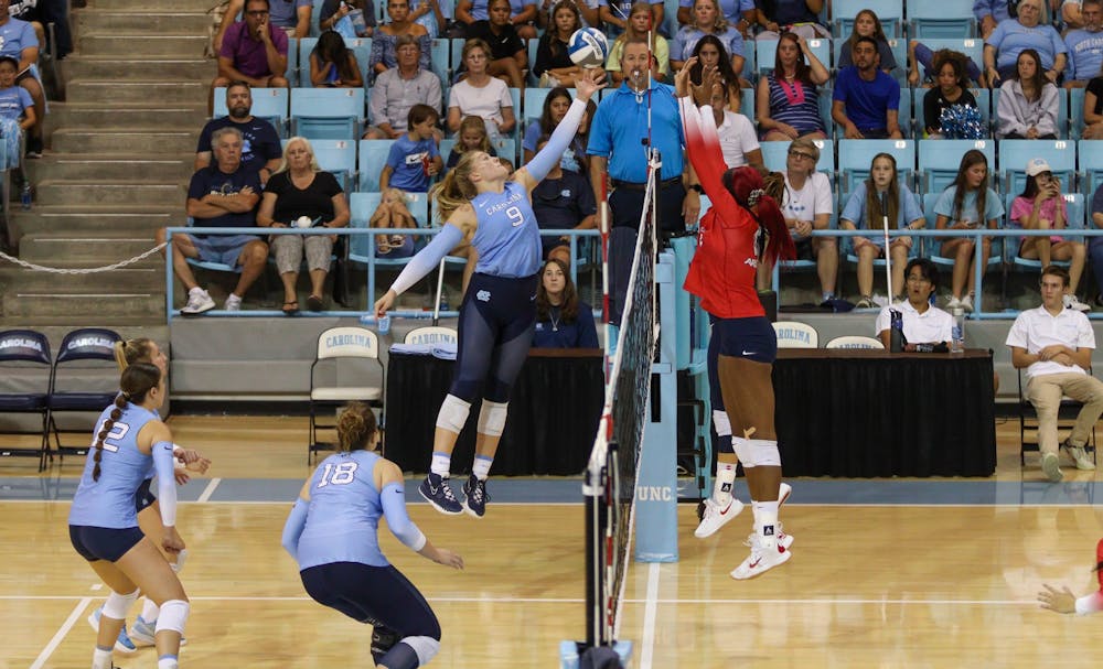Sophomore outside hitter Mabrey Shaffmaster (9) goes to block a set from Arizona hitters over the net. UNC beat Arizona 3-2 at home on Saturday, Sept. 3, 2022.