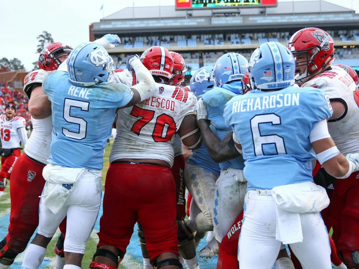UNC and NC State players fight in a post-game brawl on Saturday, Nov. 24 in Kenan Memorial Stadium. NC State beat UNC 34-28 in overtime.