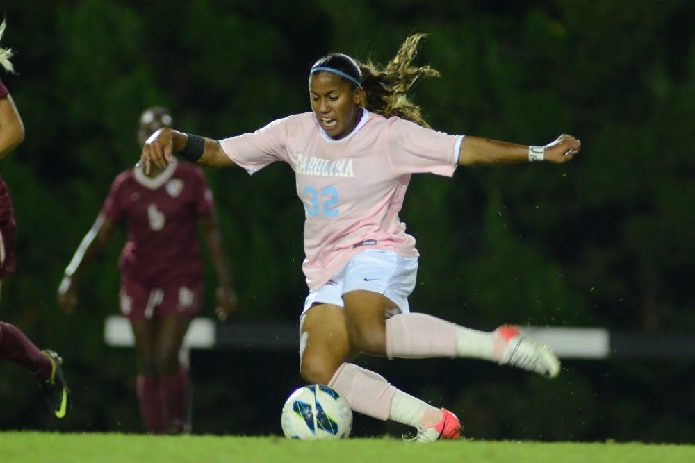 UNC Junior Meg Morris (32) takes a shot on goal. 