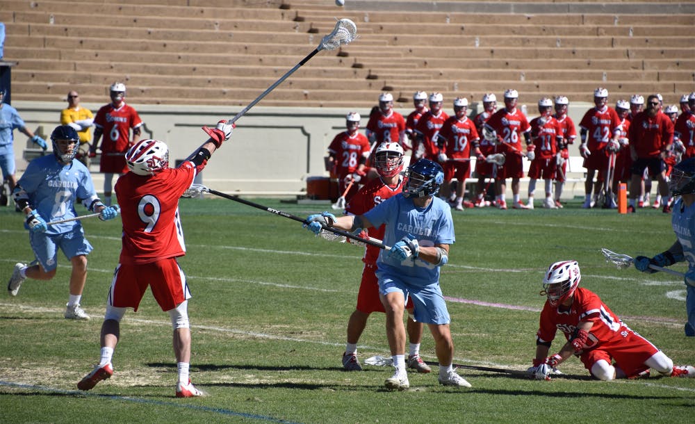 'He's our family' UNC men's lacrosse head coach Joe Breschi gets 200th win The Daily Tar Heel