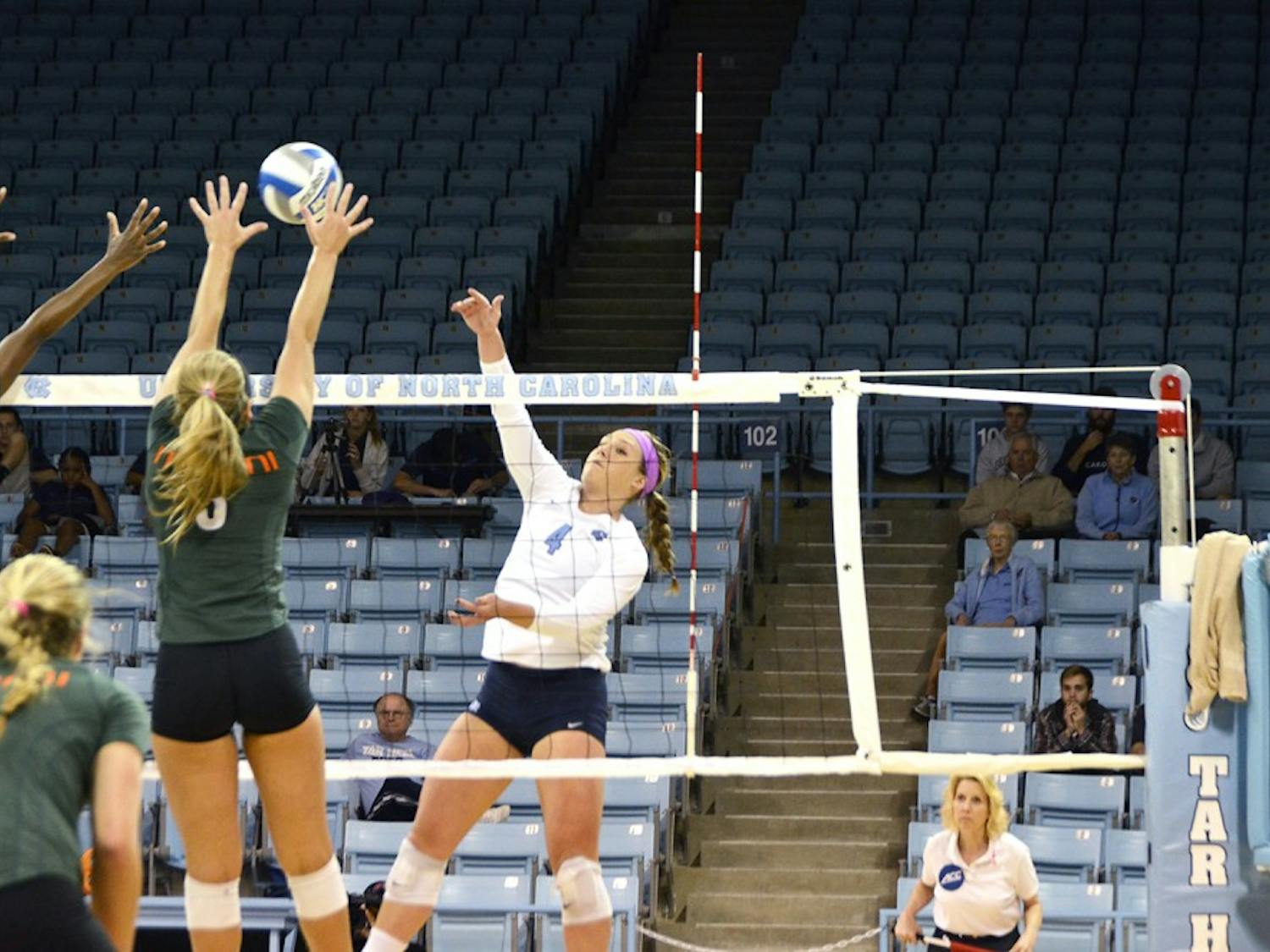 Leigh Andrew, a junior outside hitter, spikes a ball against Miami on Friday. UNC won 3-0 against the Miami Hurricanes.