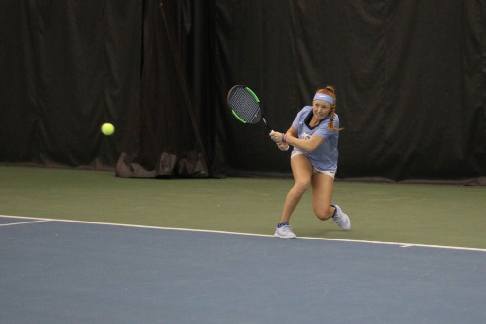 Junior Sara Daavettila takes a shot during her singles match against Virginia Commonwealth University on Jan. 26, 2019.