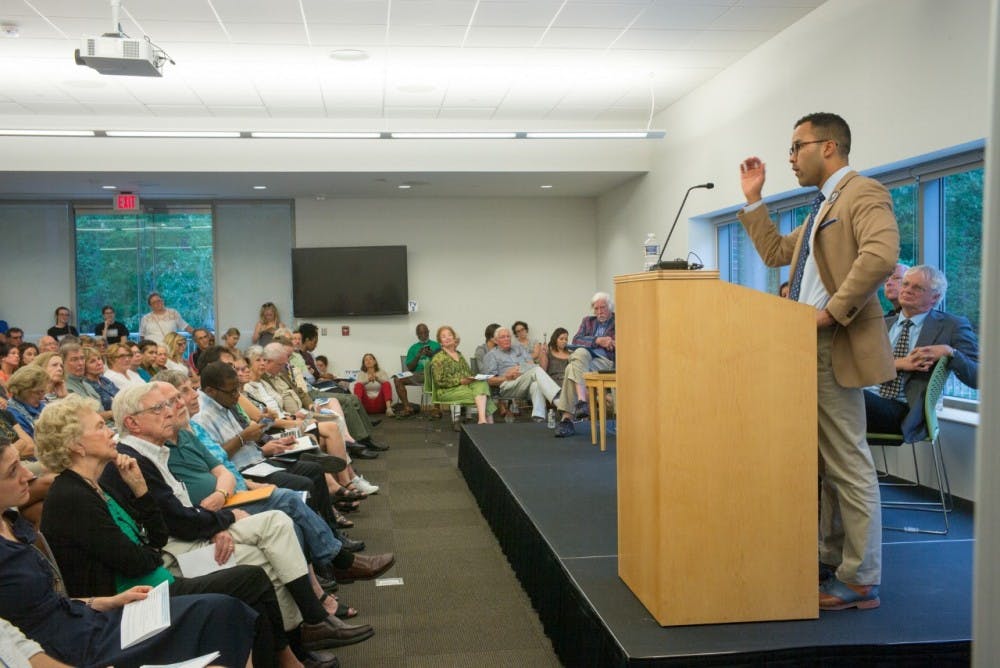William Sturkey speaking at an Aug. 30, 2017 event titled, “Beyond the Headlines: Confederate Monuments, Historical Memory, & Free Speech” at the Chapel Hill Public Library. Photo courtesy of Andrew Kornylak. 
