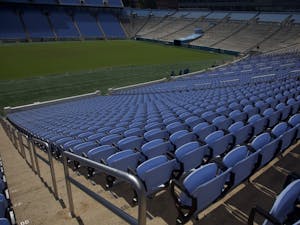 New Carolina blue seats are installed in Kenan Memorial Stadium on September 29th, 2018.