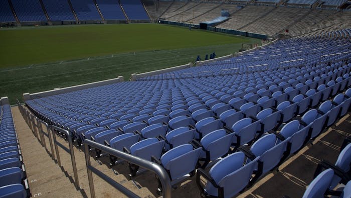 New Carolina blue seats are installed in Kenan Memorial Stadium on September 29th, 2018.