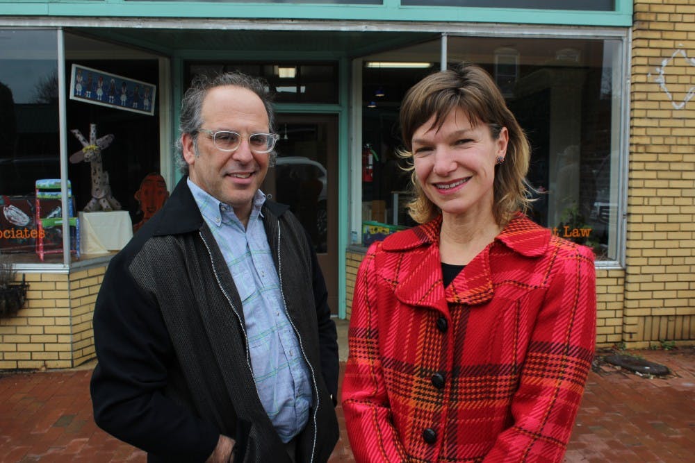 <p>Mark Dorosin (left) and Elizabeth Haddix (right), co-directors of the newly founded Julius L. Chambers Center for Civil Rights, pose for a portrait outside the new center in Pittsboro, NC.&nbsp;</p>