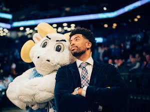 ACC Network Analyst and former Tar Heel KJ Smith poses with Rameses at the ACC Men's Basketball Tournament on March 11, 2022 at the Barclays Center. Photo courtesy of Jeff Armstrong.