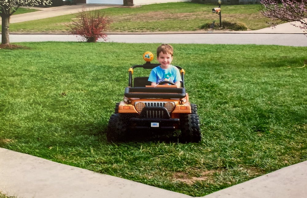 <p>A young Preston Fore happily drives his toy Jeep through his yard.<br>
Photo Courtesy of the Fore Family.</p>